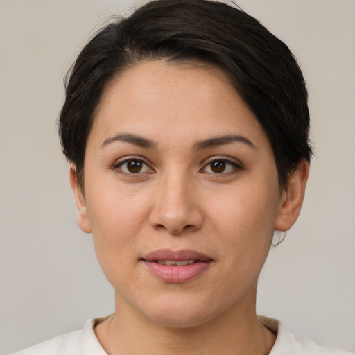 Joyful white young-adult female with short  brown hair and brown eyes