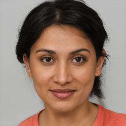 Joyful white young-adult female with medium  brown hair and brown eyes