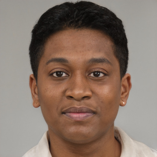 Joyful latino young-adult male with short  brown hair and brown eyes