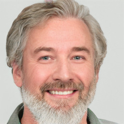 Joyful white middle-aged male with short  brown hair and blue eyes