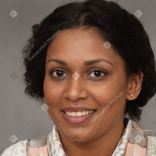 Joyful black adult female with medium  brown hair and brown eyes