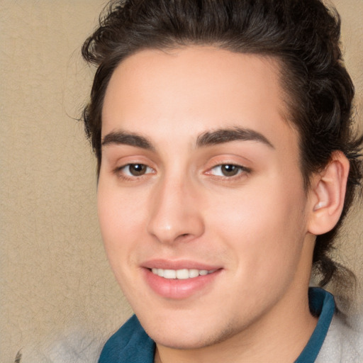 Joyful white young-adult male with medium  brown hair and brown eyes