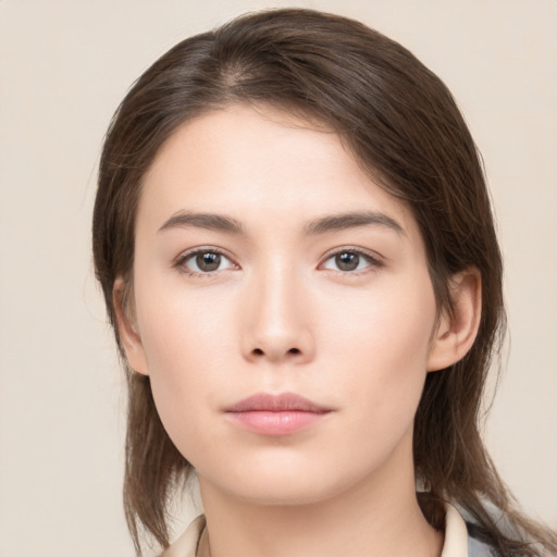 Neutral white young-adult female with medium  brown hair and brown eyes