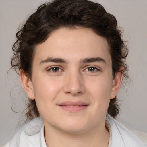 Joyful white young-adult male with medium  brown hair and brown eyes