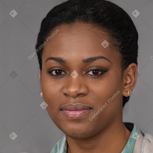 Joyful black young-adult female with short  black hair and brown eyes