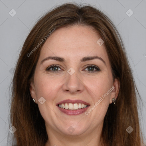 Joyful white adult female with long  brown hair and brown eyes