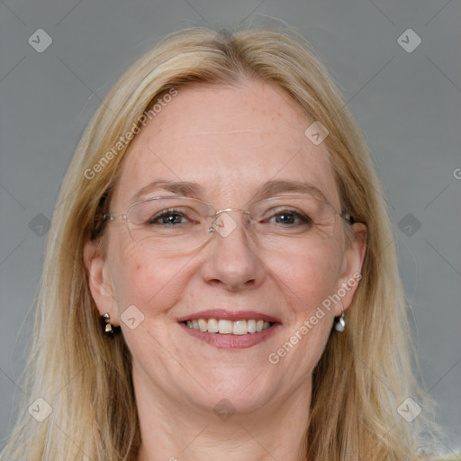 Joyful white adult female with long  brown hair and blue eyes