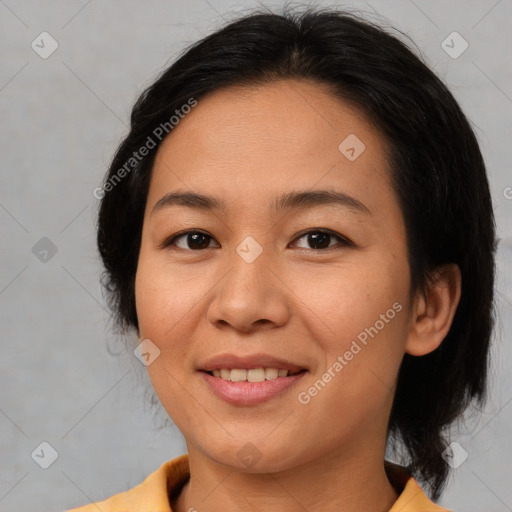 Joyful asian young-adult female with medium  brown hair and brown eyes