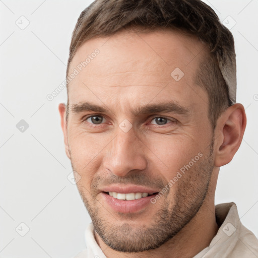 Joyful white young-adult male with short  brown hair and brown eyes