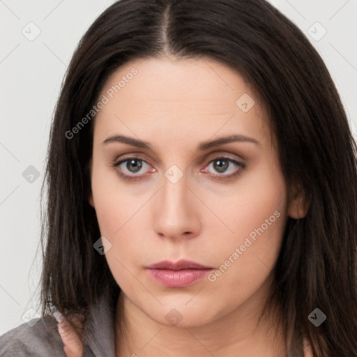 Neutral white young-adult female with long  brown hair and brown eyes