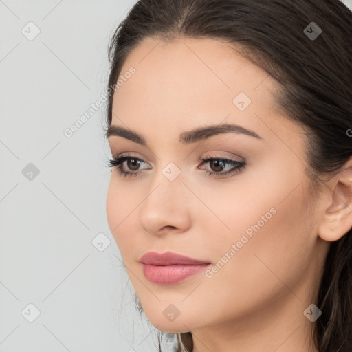 Neutral white young-adult female with long  brown hair and brown eyes