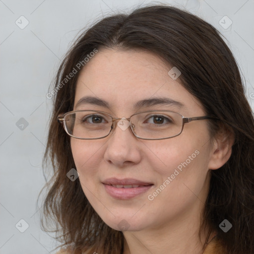 Joyful white adult female with medium  brown hair and brown eyes