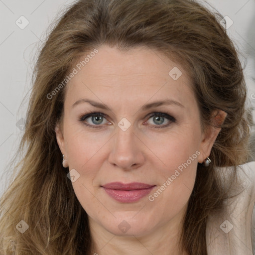 Joyful white adult female with long  brown hair and brown eyes