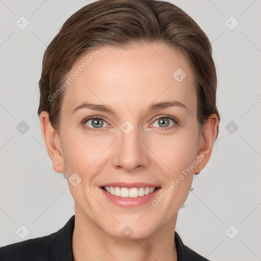 Joyful white young-adult female with short  brown hair and grey eyes