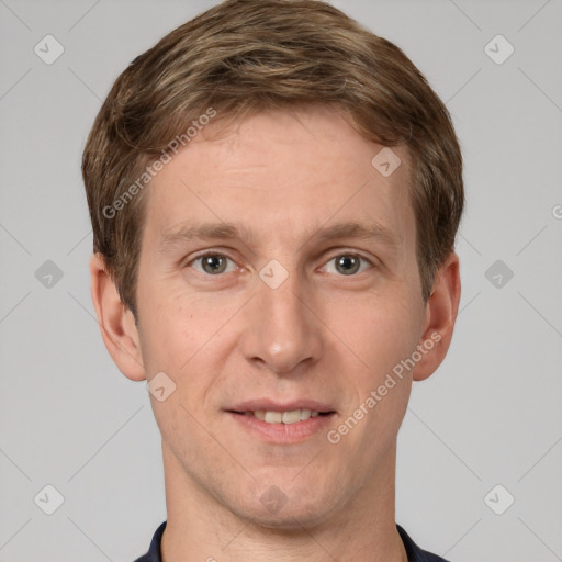 Joyful white adult male with short  brown hair and grey eyes