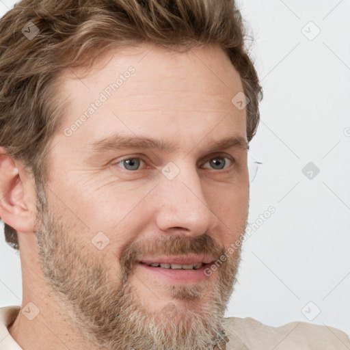 Joyful white adult male with short  brown hair and grey eyes