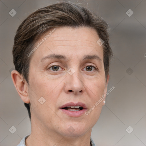 Joyful white adult female with short  brown hair and grey eyes