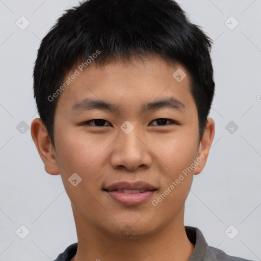 Joyful asian young-adult male with short  black hair and brown eyes