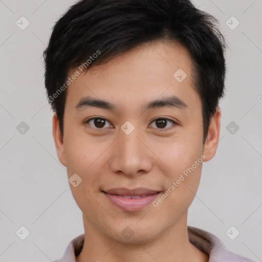 Joyful asian young-adult male with short  brown hair and brown eyes