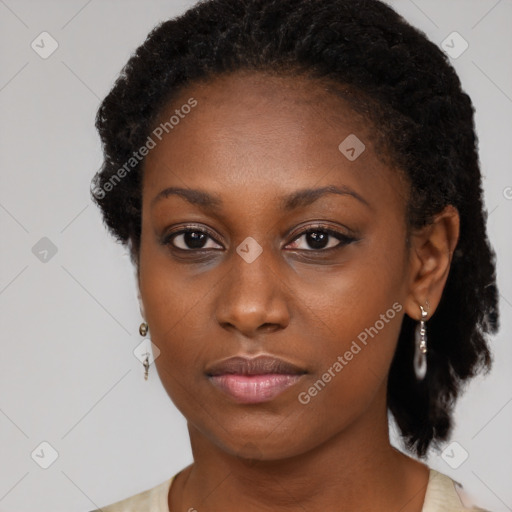 Neutral black young-adult female with medium  black hair and brown eyes