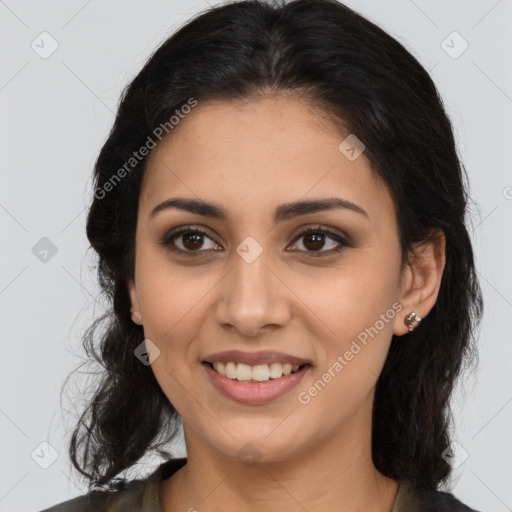 Joyful latino young-adult female with long  brown hair and brown eyes