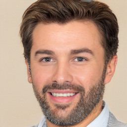 Joyful white adult male with short  brown hair and brown eyes