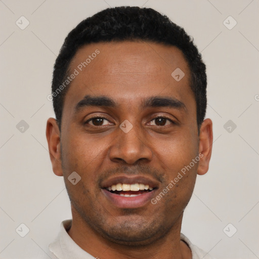 Joyful black young-adult male with short  black hair and brown eyes