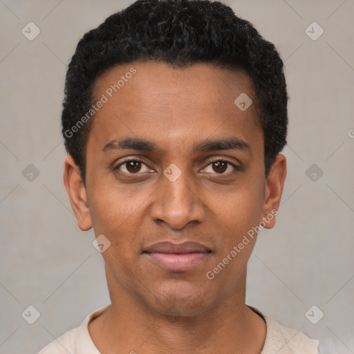 Joyful black young-adult male with short  black hair and brown eyes