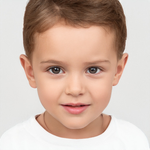 Joyful white child male with short  brown hair and brown eyes