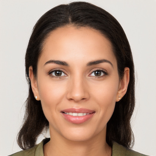 Joyful white young-adult female with medium  brown hair and brown eyes