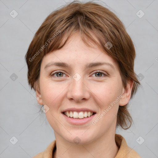 Joyful white young-adult female with medium  brown hair and grey eyes