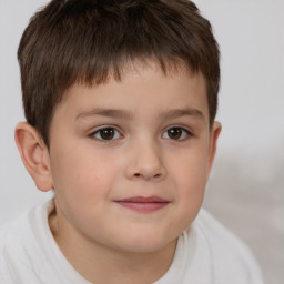 Joyful white child male with short  brown hair and brown eyes