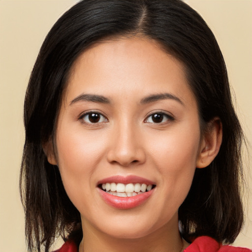 Joyful white young-adult female with medium  brown hair and brown eyes