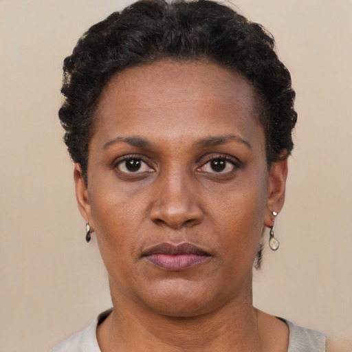 Neutral black young-adult female with short  black hair and brown eyes