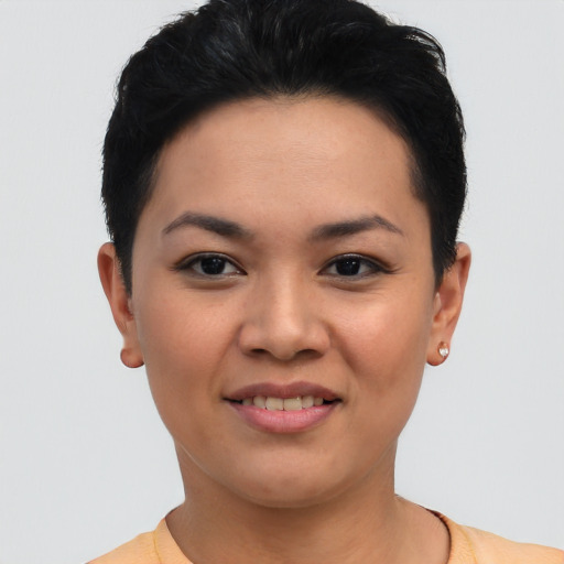 Joyful asian young-adult female with short  brown hair and brown eyes