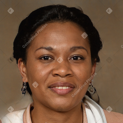 Joyful black adult female with short  brown hair and brown eyes