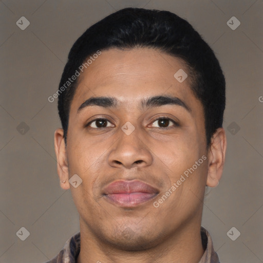 Joyful latino young-adult male with short  black hair and brown eyes