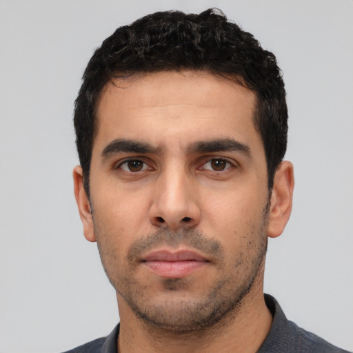 Neutral white young-adult male with short  black hair and brown eyes