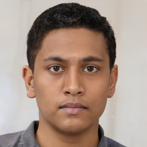 Neutral latino young-adult male with short  black hair and brown eyes