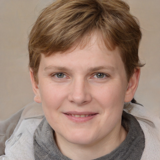 Joyful white young-adult female with medium  brown hair and blue eyes