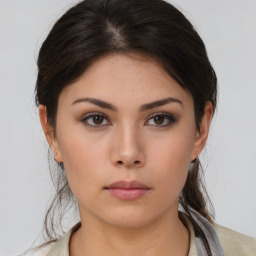 Neutral asian young-adult female with medium  brown hair and brown eyes