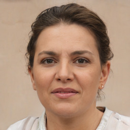 Joyful white adult female with short  brown hair and brown eyes