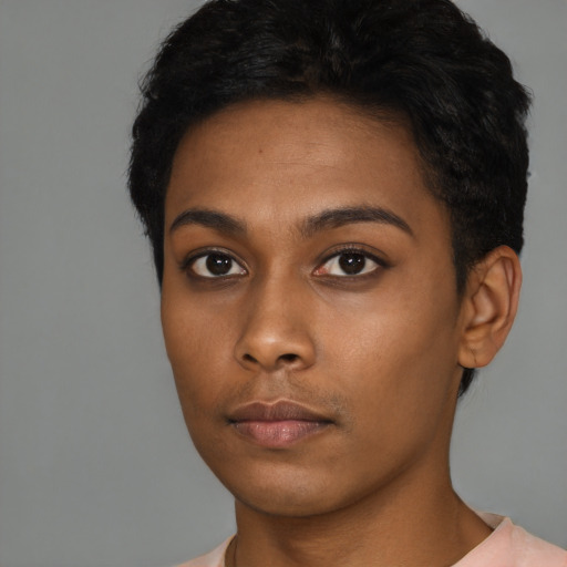 Neutral black young-adult female with short  black hair and brown eyes
