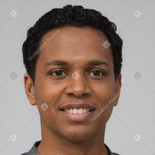 Joyful black young-adult male with short  black hair and brown eyes