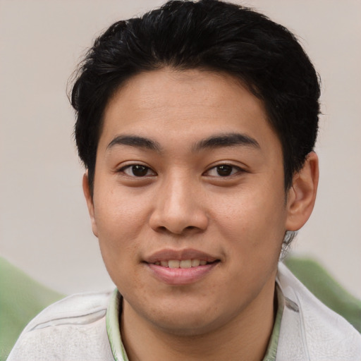 Joyful asian young-adult male with short  black hair and brown eyes