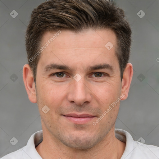 Joyful white adult male with short  brown hair and brown eyes