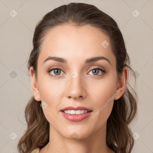 Joyful white young-adult female with medium  brown hair and green eyes