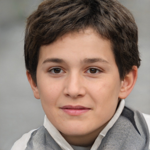 Joyful white child male with short  brown hair and brown eyes