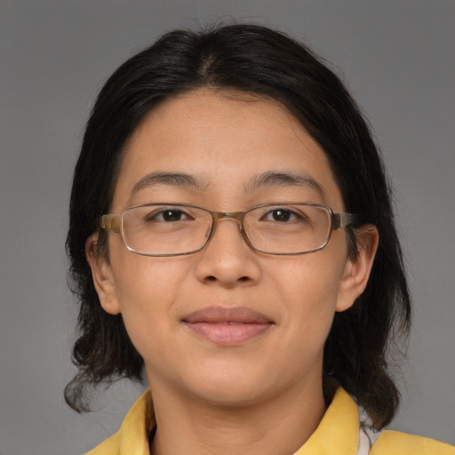 Joyful white adult female with medium  brown hair and brown eyes