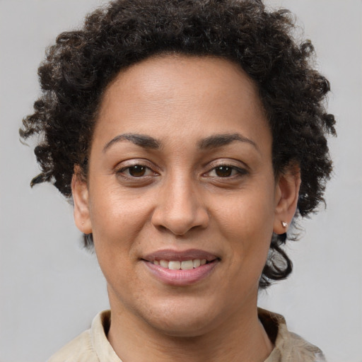 Joyful white adult female with short  brown hair and brown eyes